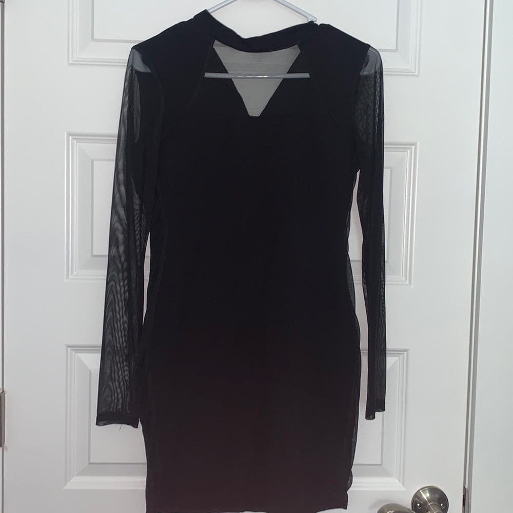 Tight black dress with sheer sleeves